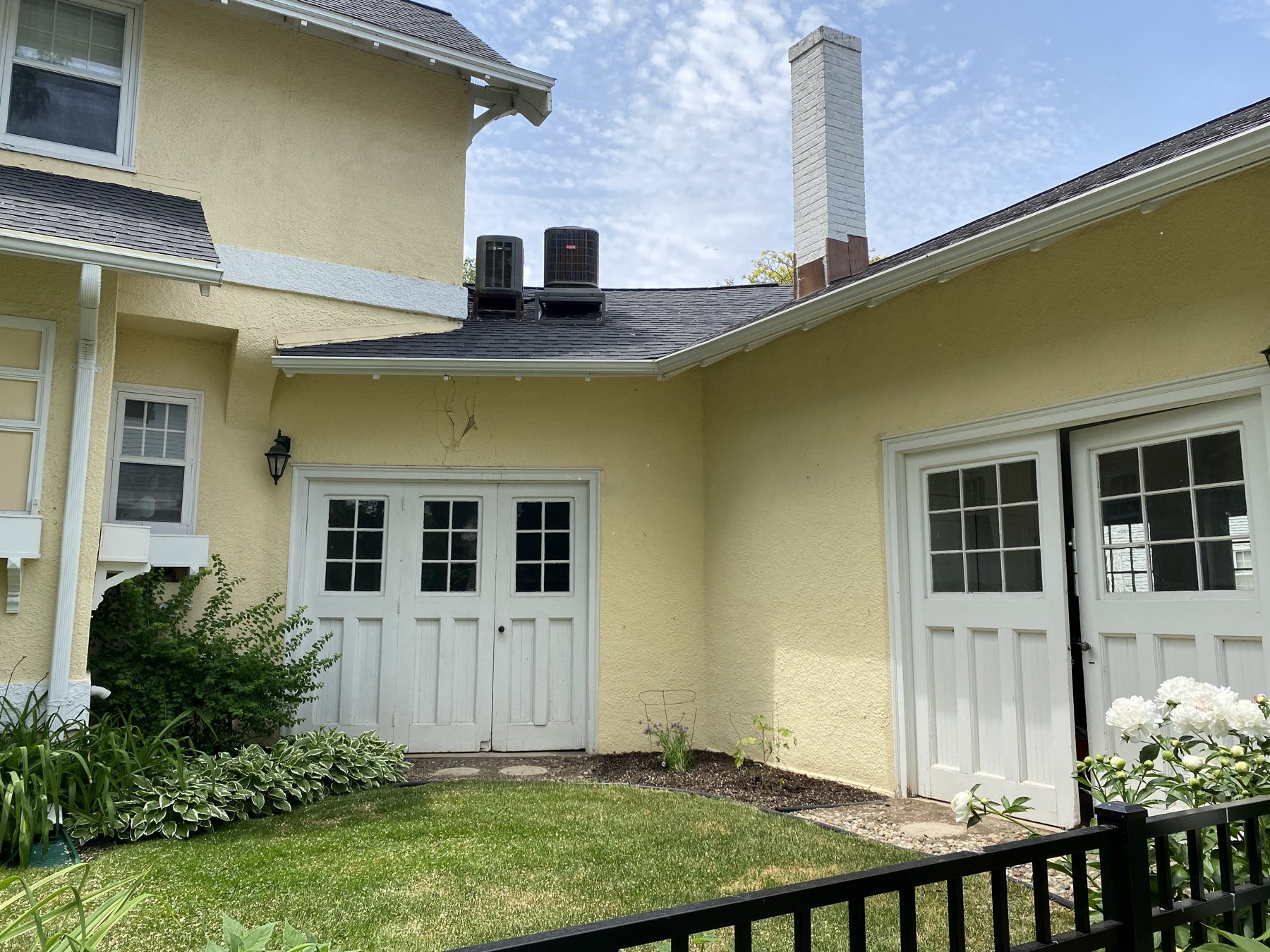 Original glazed and hinged doors on the 9th Street side
